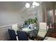 Cozy dining area with a glass table and a modern display cabinet at 1507 Smithfield Dr, Mcdonough, GA 30252
