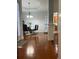 Elegant dining room featuring a modern chandelier and sleek glass table at 1507 Smithfield Dr, Mcdonough, GA 30252