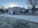 Exterior view of brick home with attached garage and long driveway at 1507 Smithfield Dr, Mcdonough, GA 30252