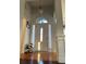 Grand foyer featuring high ceilings, chandelier, and hardwood floors at 1507 Smithfield Dr, Mcdonough, GA 30252