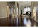 Bright foyer leading to dining area featuring hardwood floors and natural light at 1507 Smithfield Dr, Mcdonough, GA 30252