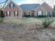 Charming brick home featuring black shutters and a well-maintained lawn at 1507 Smithfield Dr, Mcdonough, GA 30252