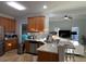 Modern kitchen featuring wooden cabinets, stainless steel appliances, and a breakfast bar at 1507 Smithfield Dr, Mcdonough, GA 30252