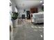 Open living area with tiled floors and a view of the dining and kitchen spaces at 1507 Smithfield Dr, Mcdonough, GA 30252