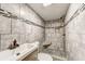 Bathroom with a shower, sink, and toilet, featuring tile and a niche at 1472 Norman Berry Dr, Atlanta, GA 30344
