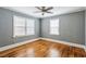 Bedroom featuring hardwood floors and windows providing natural light at 1472 Norman Berry Dr, Atlanta, GA 30344