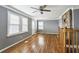 Open living room with hardwood floors, natural light, and a stone fireplace at 1472 Norman Berry Dr, Atlanta, GA 30344