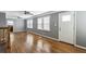 Bright living room with hardwood floors, modern ceiling fans and many windows at 1472 Norman Berry Dr, Atlanta, GA 30344
