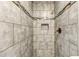 Tiled shower stall with bronze fixtures and built-in niche at 1472 Norman Berry Dr, Atlanta, GA 30344
