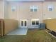 Cozy backyard with a small patio, grassy area, and privacy fence at 2693 Avanti Way, Decatur, GA 30035
