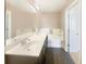 Elegant bathroom with double vanity, a soaking tub, and modern fixtures at 2693 Avanti Way, Decatur, GA 30035