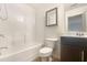 Bright, clean bathroom with a tub/shower combo and modern vanity offers comfort at 2693 Avanti Way, Decatur, GA 30035