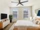 Comfortable bedroom with neutral walls, plush bedding, and natural light from two windows at 2693 Avanti Way, Decatur, GA 30035