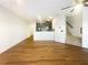 Open concept living room showcases hardwood floors and seamless transition to modern kitchen at 2693 Avanti Way, Decatur, GA 30035