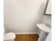 Cozy powder room with pedestal sink and tile floors provides essential convenience at 2693 Avanti Way, Decatur, GA 30035