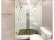 Modern bathroom featuring glass enclosed shower, tile surround, and sleek fixtures at 2693 Avanti Way, Decatur, GA 30035