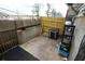 Fenced backyard and patio with storage and an air conditioning unit at 2726 Evans Mill Dr, Lithonia, GA 30058