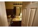 Bathroom with unique multicolor tiled wall and mirror above single sink vanity at 2726 Evans Mill Dr, Lithonia, GA 30058