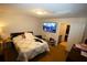 Bedroom featuring a cozy bed, TV, and ample storage space at 2726 Evans Mill Dr, Lithonia, GA 30058