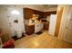 The kitchen has tile flooring, gas range, dishwasher, and door at 2726 Evans Mill Dr, Lithonia, GA 30058