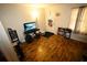 Cozy living room boasts wood floors and plenty of natural light through the window at 2726 Evans Mill Dr, Lithonia, GA 30058
