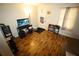 Bright living room with wood floors, large window, and ample space for entertaining at 2726 Evans Mill Dr, Lithonia, GA 30058