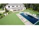 Breathtaking aerial perspective of a backyard featuring a sparkling pool, jacuzzi, patio, and manicured lawn at 4428 Blackland Dr, Marietta, GA 30067