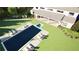 Overhead view of a luxurious backyard showcasing a pool, hot tub, patio, and lush green lawn at 4428 Blackland Dr, Marietta, GA 30067