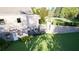 Landscaped backyard with beautiful stone retaining wall, patio, and view of the in-ground pool at 4428 Blackland Dr, Marietta, GA 30067