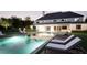 Luxurious backyard pool area illuminated at night, offering a serene and inviting space for relaxation and entertainment at 4428 Blackland Dr, Marietta, GA 30067
