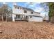 The home has a deck overlooking the expansive backyard and wooded area at 211 Congress Pkwy, Lawrenceville, GA 30044