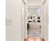 Hallway view of the bathroom featuring a tub and vanity at 211 Congress Pkwy, Lawrenceville, GA 30044