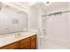Bathroom featuring a tub, vanity, and mirror at 211 Congress Pkwy, Lawrenceville, GA 30044