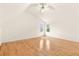 The bright bedroom features a vaulted ceiling, hardwood floors and windows at 211 Congress Pkwy, Lawrenceville, GA 30044