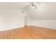 A vaulted ceiling and gleaming hardwood floors are featured in this bedroom at 211 Congress Pkwy, Lawrenceville, GA 30044