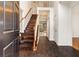 Inviting foyer featuring hardwood floors, a staircase, and a bright, open entrance at 211 Congress Pkwy, Lawrenceville, GA 30044
