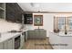 Modern kitchen with sleek countertops, stainless steel appliances, and a stylish, updated design at 211 Congress Pkwy, Lawrenceville, GA 30044