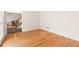 Bright living room featuring gleaming hardwood floors and natural light streaming through the windows at 211 Congress Pkwy, Lawrenceville, GA 30044