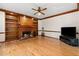 Charming living room with a fireplace, built-in shelving, and hardwood floors, perfect for relaxation at 211 Congress Pkwy, Lawrenceville, GA 30044