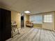 Finished basement with vinyl flooring, a window, and access to a bathroom at 5862 Kitchens Se Rd, Mableton, GA 30126