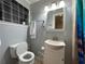 Cozy bathroom featuring a white vanity, toilet, and decorative shower curtain at 5862 Kitchens Se Rd, Mableton, GA 30126