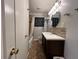 Bathroom featuring granite countertops, a tiled shower, and modern fixtures at 5862 Kitchens Se Rd, Mableton, GA 30126