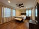 Relaxing bedroom with hardwood floors, ceiling fan, and natural light at 5862 Kitchens Se Rd, Mableton, GA 30126