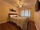 Comfortable bedroom with hardwood floors, natural light, and stylish decor at 5862 Kitchens Se Rd, Mableton, GA 30126