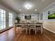 Cozy dining room with hardwood floors and access to the deck at 5862 Kitchens Se Rd, Mableton, GA 30126