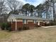 A well-kept ranch-style house with a brick front and tasteful landscaping details at 5862 Kitchens Se Rd, Mableton, GA 30126