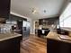 Modern kitchen with granite countertops, stainless steel appliances, and wood-look flooring at 5862 Kitchens Se Rd, Mableton, GA 30126