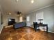 Bright living area with hardwood floors, ceiling fan, desk and natural light from multiple windows at 5862 Kitchens Se Rd, Mableton, GA 30126