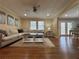 Bright and airy living room flowing into the dining area with hardwood floors at 5862 Kitchens Se Rd, Mableton, GA 30126