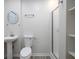 Cozy bathroom featuring a pedestal sink, toilet and a shower stall with glass doors at 742 Olde Towne Ln, Marietta, GA 30068